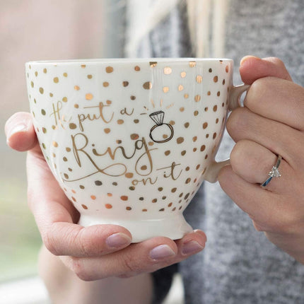 CREATIVE TOPS AVA & I HE PUT A RING ON IT FOOTED MUG